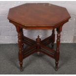 A mahogany cross frame octagonal window table.