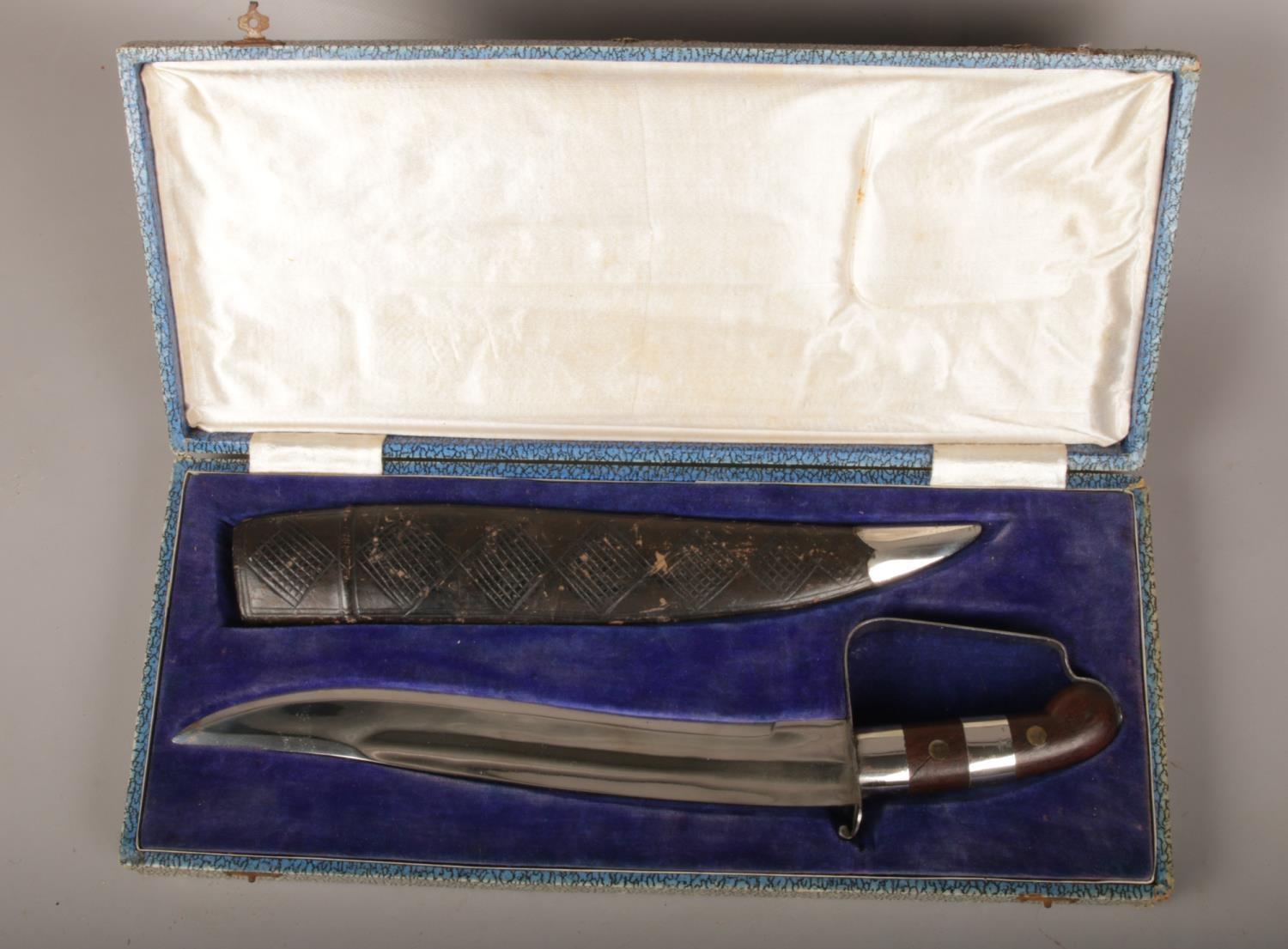 A Middle Eastern Bowie Knife with leather scabbard in original box