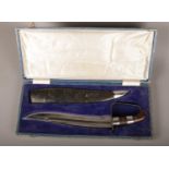 A Middle Eastern Bowie Knife with leather scabbard in original box