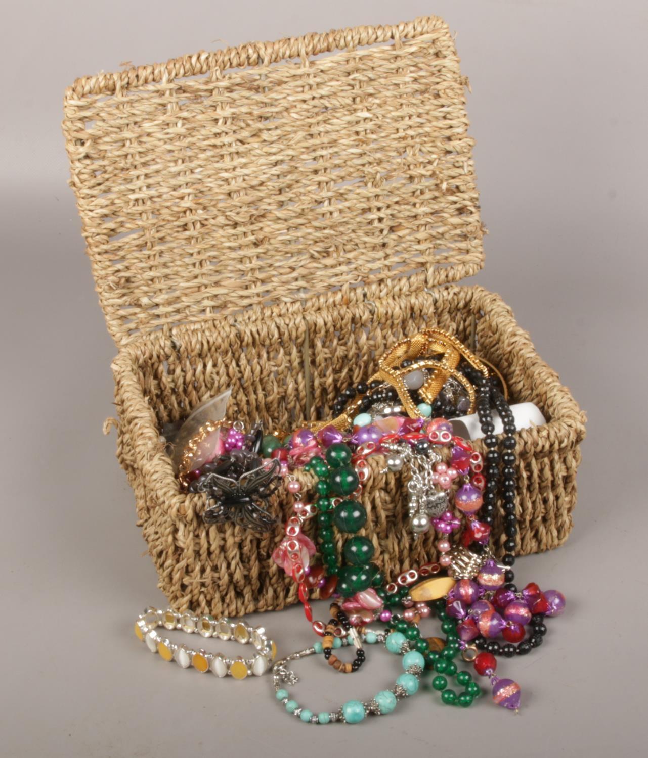 A box of costume jewellery, beads, necklaces, bangles, bracelets etc