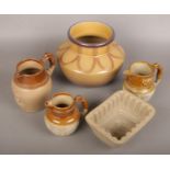 A collection of c19th stoneware to include salt glazed jugs with sprig moulding decoration, jelly