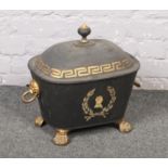 A 19th century toleware coal perdonium. With lion mask loop handles and paw feet. Later ebonized,