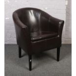 A leather tub arm chair.