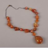 An amber necklace, of irregular form.