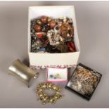 A box of costume jewellery to include beads, bangles necklaces earrings etc.