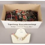 A box of costume jewellery to include necklaces, beads, bangles, etc.