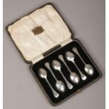 A cased set of six George V silver teaspoons by Martin Hall & Co Ltd. With trefid terminals. Assayed