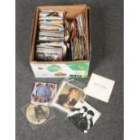 A box of pop single records