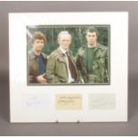 An autographed The Professors display, with autographs from Martin Shaw, Gordon Jackson and Lewis