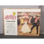 A quad film poster for Grease.