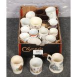 A box of miscellaneous tea cups to include mostly commemorative examples.