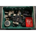 A box of microscope accessories and a collection of chemical bottle stoppers.