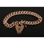A 9ct gold curb bracelet with heart shaped clasp, 14.7 grams.