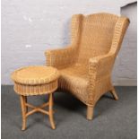 A wicker arm chair and matching table.