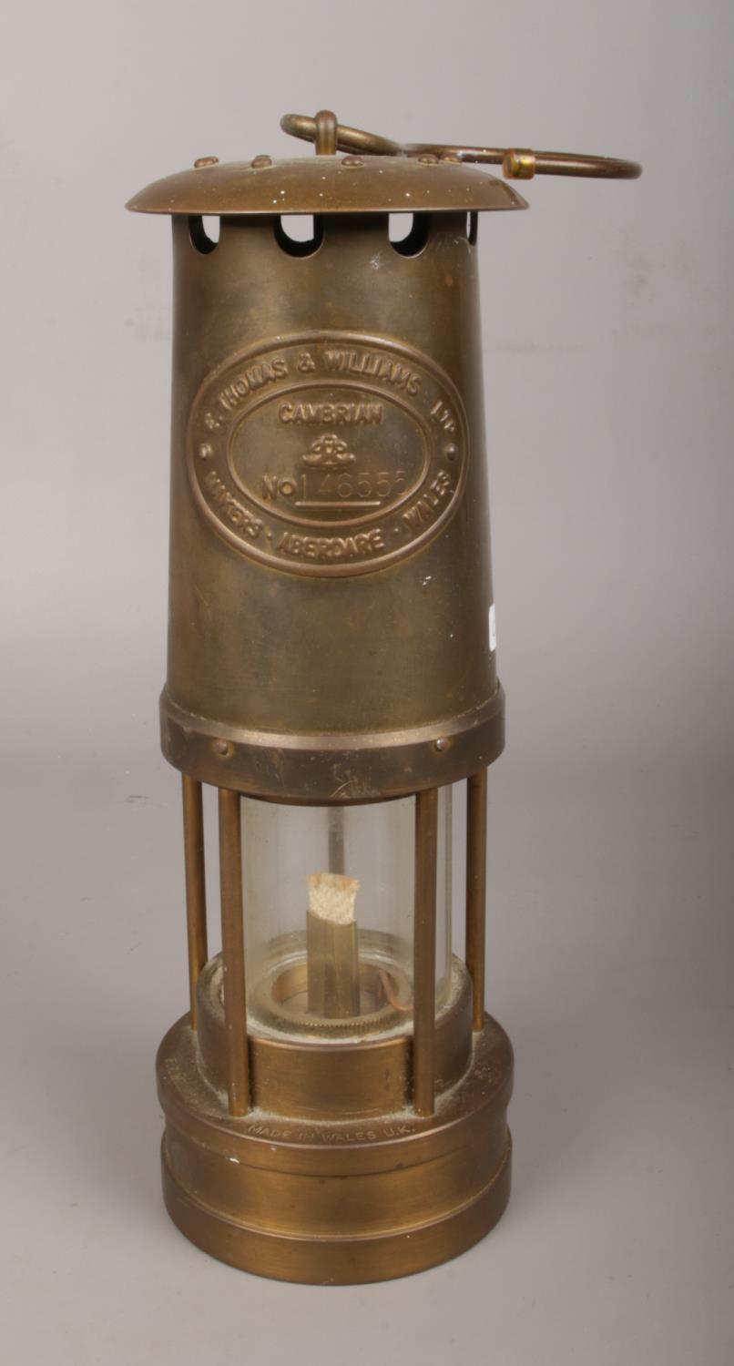 A Thomas & Williams Ltd brass miner's lamp.