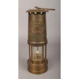 A Thomas & Williams Ltd brass miner's lamp.