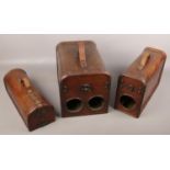 Three antique style wine carriers.