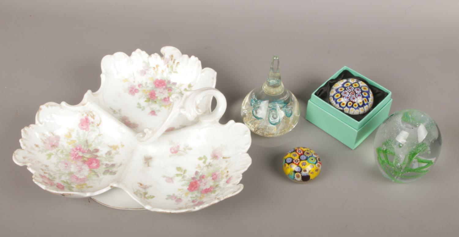 Four polychrome glass paperweights including a boxed example along with a Limoges trefoil