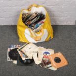 A bag of single records, to include The Beatles, The Who, Shirley Bassey etc.