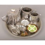 A group lot of metalwares to include silver plate teapot, silver plate circular tray, trinket dishes