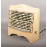 A vintage Belling & Co electric heater.