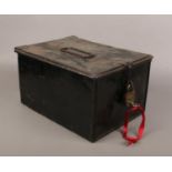 A tin deed box with padlock and key.