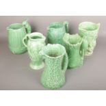 Six green Sylvac jugs to include squirrel handle example etc.