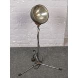 An industrial lamp on stand.