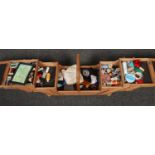 A cantilever sewing box and contents of sewing equipment, to include Sylko thread, thimbles etc.