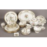 A collection of Coalport Ming Rose dinner wares, dinner plates, cups and saucers, milk jug, sugar