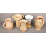 Three Arthur Wood ceramic jugs and one twin handle vase along with another Falcon ware vase.