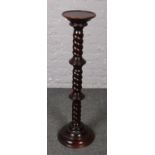 A mahogany jardiniere stand, with barley twist column. Generally good. Varnish wear to top edge.
