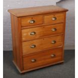 A Victorian satinwood two over three chest of drawers, 106cm high, 91cm wide, 48cm deep.