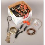 A box of costume jewellery to include bangles, beads, earrings, necklaces, bracelets etc.