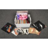 A box of single records, with 12inch examples, to include Dire Straits, U2, The Jacksons etc.