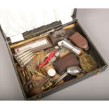 A case of collectables, to include Yorkshire Penny Bank book safe, bullets, religious items etc.