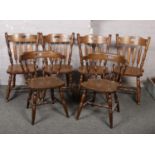 A pair of hardwood Captains chairs and set of four similar dining chairs.