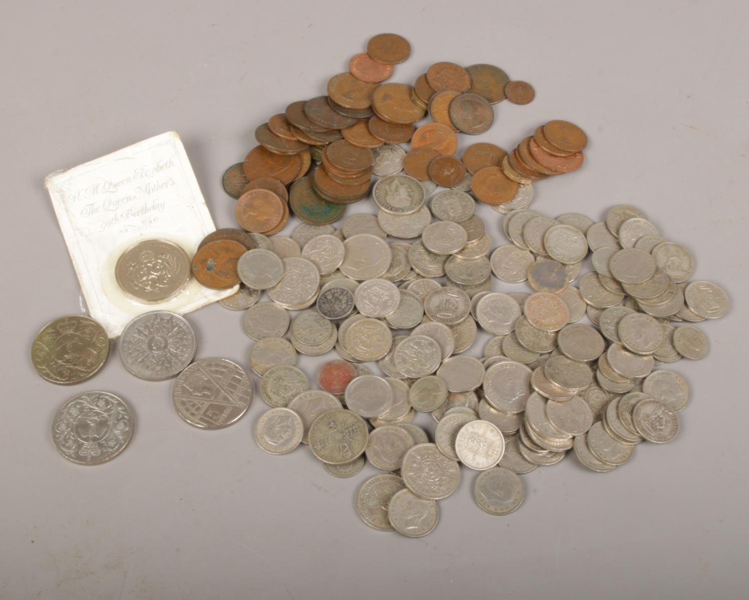 A collection of mainly pre decimal coins, shillings, sixpences, florins, half penny, three pence