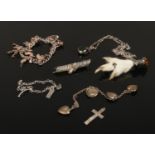 A small collection of mainly silver jewellery including charm bracelets, pheasants foot brooch,