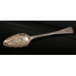 A George III embossed silver berry spoon. Assayed London 1807, 68 grams. Good condition. This may