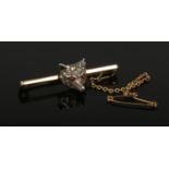 A 9ct gold fox mask bar brooch by Henry Griffith & Sons. Set with rose cut diamonds and cabochon