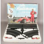 A boxed Carlos Reutemann Racing System game, made by Polistil.