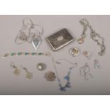 A collection of silver and white metal jewellery. Including a niello work cigarette case, Scottish