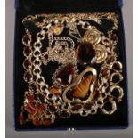 A jewellery box containing vintage costume jewellery, brown paste set Hollywood brooch and similar