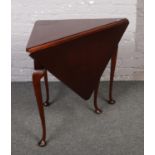 A mahogany corner drop leaf table.