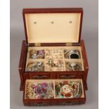 A jewellery box of costume jewellery to include rings, brooches, necklaces, bangles etc.