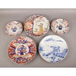 Five early 20th century Japanese dishes, mostly Imari, to include one with figures. Chips and