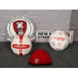 A collection of Rotherham United FC memorabilia to include signed footballs, tin sign, clock etc.