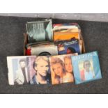 A box of 45 r.p.m records, Joe Cocker, Kylie & Jason, Olivia Newton John examples