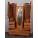 A satinwood triple dressing table.